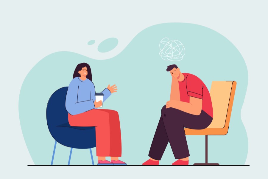 Rysunkowy pacjent podczas wizyty u specjalisty zdrowia psychicznego.