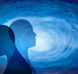 Zacieniony i rozświetlony profil ludzkiej głowy. Symbolizują chorobę dwubiegunową.