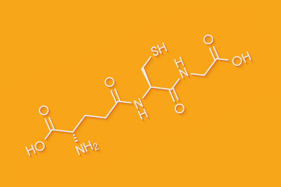 Wzór chemiczny glutationu na pomarańczowym tle.