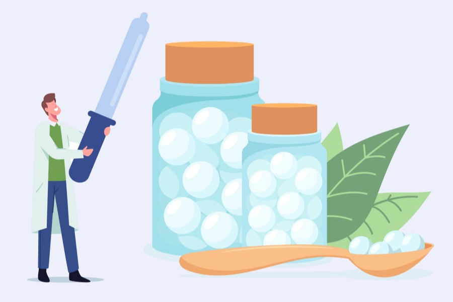 Rysunkowa osoba badająca leki homeopatyczne.