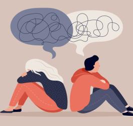 Dwie rysunkowe osoby, które próbują prowadzić dialog.