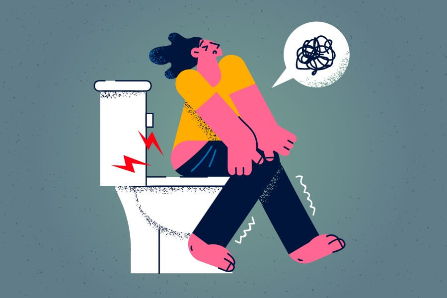 Rysunkowa postać siedzi na toalecie, męczy ją uciążliwa biegunka.