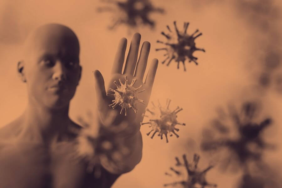 Człowiek symbolizujący układ odpornościowy, który chroni organizm przed wirusami.