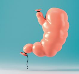 Napompowany balonik w kształcie żołądka, symbolizujący wzdęcia brzucha.